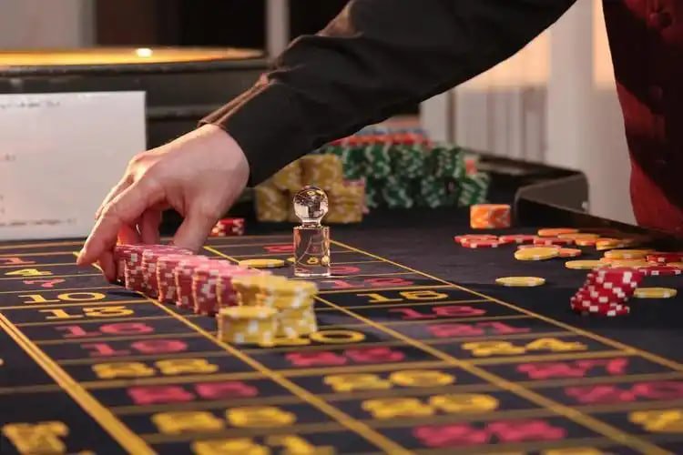 Smartphone displaying Winbs platform interface with sports and gaming options